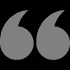 a gray quote symbol on a black background